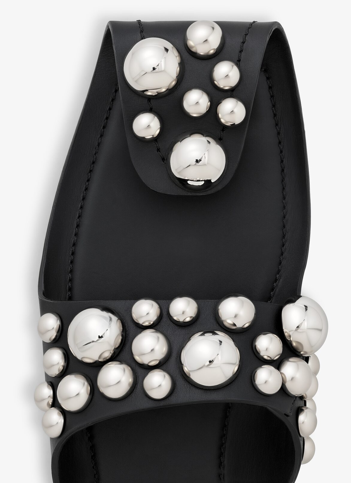 FOLDED FLAT MULES WITH SPHERES ON CALFSKIN ALAÏA BLACK FOLDED FLAT MULES WITH SPHERES ON CALFSKIN
